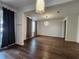 Open living space with hardwood floors, stylish lighting, and lots of natural light at 3794 Allegretto Cir, Atlanta, GA 30339