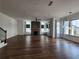 Open living room with fireplace, hardwood floors, and windows, perfect for entertaining at 3794 Allegretto Cir, Atlanta, GA 30339