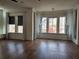 Bright living room with hardwood floors, modern lighting, and large windows at 3794 Allegretto Cir, Atlanta, GA 30339