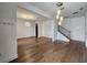 Spacious living area featuring gleaming hardwood floors and modern lighting fixtures at 3794 Allegretto Cir, Atlanta, GA 30339