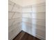 Well-organized pantry with wire shelving and wood floor offers ample storage space at 3794 Allegretto Cir, Atlanta, GA 30339