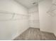 Walk-in closet with neutral carpet and metal shelves at 3794 Allegretto Cir, Atlanta, GA 30339