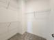 Walk-in closet with neutral carpet and metal shelves at 3794 Allegretto Cir, Atlanta, GA 30339