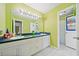 Bright bathroom with double vanity, large mirror, and shower stall at 6520 Roswell Rd # 74, Atlanta, GA 30328
