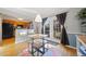 Bright dining area with hardwood floors and access to an outdoor patio through glass doors at 6520 Roswell Rd # 74, Atlanta, GA 30328
