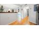 Hallway with hardwood floors that leads to the kitchen and another room at 6520 Roswell Rd # 74, Atlanta, GA 30328
