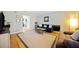 Comfortable living room with hardwood floors, a dark sofa, and a neutral area rug at 6520 Roswell Rd # 74, Atlanta, GA 30328
