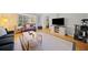 Living room showcasing hardwood floors, a large television, and comfortable furnishings at 6520 Roswell Rd # 74, Atlanta, GA 30328