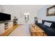 Inviting living room with hardwood floors, a dark sofa, and a wooden coffee table at 6520 Roswell Rd # 74, Atlanta, GA 30328