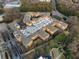 Aerial view of the community featuring lush landscaping, parking, and multiple residential buildings at 10 Perimeter Summit Ne Blvd # 2405, Atlanta, GA 30319