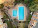 Aerial view of pool area, beautiful landscaping, and a cozy outdoor seating area at 10 Perimeter Summit Ne Blvd # 2405, Atlanta, GA 30319
