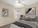 Bedroom featuring a ceiling fan, neutral walls, a window, and decorative art at 10 Perimeter Summit Ne Blvd # 2405, Atlanta, GA 30319
