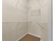 Walk in closet with adjustable metal shelving and carpet flooring at 10 Perimeter Summit Ne Blvd # 2405, Atlanta, GA 30319