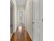 Hallway with light walls and dark wood flooring leads to other rooms at 10 Perimeter Summit Ne Blvd # 2405, Atlanta, GA 30319