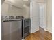 Convenient laundry room with a modern washer and dryer set and storage shelving at 10 Perimeter Summit Ne Blvd # 2405, Atlanta, GA 30319