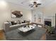 Bright living room features a fireplace, fan, and glass doors to a balcony, with a marble coffee table at 10 Perimeter Summit Ne Blvd # 2405, Atlanta, GA 30319