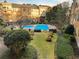 A picturesque view of a community pool surrounded by lush landscaping and multiple lounge chairs at 10 Perimeter Summit Ne Blvd # 2405, Atlanta, GA 30319