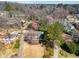 Aerial view of homes with manicured lawns, swimming pools, and mature trees in a well-planned community at 3261 Turtle Lake Se Ct, Marietta, GA 30067