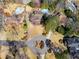 Stunning aerial view showcasing multiple neighborhood homes with swimming pools in a beautiful community at 3261 Turtle Lake Se Ct, Marietta, GA 30067