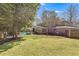 Large backyard with a pool, deck, and mature trees offering privacy at 3261 Turtle Lake Se Ct, Marietta, GA 30067