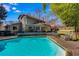 Backyard featuring a sparkling pool, spacious deck, and outdoor seating area at 3261 Turtle Lake Se Ct, Marietta, GA 30067