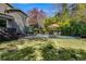 Inviting backyard pool with patio seating and lush landscaping, perfect for relaxing and entertaining at 3261 Turtle Lake Se Ct, Marietta, GA 30067