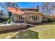Backyard view features a house extension, a deck with an umbrella and a lush green lawn at 3261 Turtle Lake Se Ct, Marietta, GA 30067