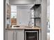 Stylish bar area with granite countertop, wine cooler, and glass rack at 3261 Turtle Lake Se Ct, Marietta, GA 30067