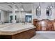 Luxury bathroom featuring double sinks, granite countertops, unique hanging light fixtures, and a large tub at 3261 Turtle Lake Se Ct, Marietta, GA 30067
