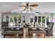 Bright dining room with vaulted ceilings, a ceiling fan and large windows at 3261 Turtle Lake Se Ct, Marietta, GA 30067