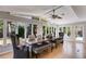 Bright dining room with a ceiling fan and floor-to-ceiling windows with backyard views at 3261 Turtle Lake Se Ct, Marietta, GA 30067