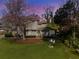Charming home featuring a landscaped front yard with stone accents and a welcoming entrance at 3261 Turtle Lake Se Ct, Marietta, GA 30067
