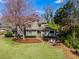Charming home featuring a landscaped front yard with stone accents and a welcoming entrance at 3261 Turtle Lake Se Ct, Marietta, GA 30067