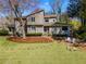 Charming home featuring a landscaped front yard with stone accents and a welcoming entrance at 3261 Turtle Lake Se Ct, Marietta, GA 30067