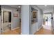 Hallway with granite countertop bar and adjacent bathroom with grey and black tile at 3261 Turtle Lake Se Ct, Marietta, GA 30067