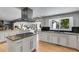 Spacious kitchen has white cabinets, an island cooktop and granite countertops at 3261 Turtle Lake Se Ct, Marietta, GA 30067