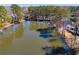 Scenic lake view featuring waterfront properties and the calm water's reflection at 3261 Turtle Lake Se Ct, Marietta, GA 30067