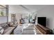 Elegant living room with vaulted ceilings, modern furnishings, and large windows at 3261 Turtle Lake Se Ct, Marietta, GA 30067