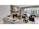 Inviting living room featuring a stone fireplace and views into the backyard and dining area at 3261 Turtle Lake Se Ct, Marietta, GA 30067