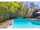 Inviting backyard pool surrounded by lush greenery provides a private oasis at 3261 Turtle Lake Se Ct, Marietta, GA 30067