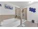 Bright bathroom with a glass enclosed shower and soaking tub at 7207 Brigidoon Rose, Douglasville, GA 30134
