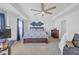Bedroom with a workstation area, ceiling fan, and a large window at 7207 Brigidoon Rose, Douglasville, GA 30134