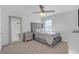 Cozy bedroom featuring plush carpet, ceiling fan, and modern furnishings at 7207 Brigidoon Rose, Douglasville, GA 30134