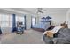 Bright bedroom with a workspace, ceiling fan, and windows at 7207 Brigidoon Rose, Douglasville, GA 30134