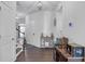 Bright entryway with hardwood floors, decor, and a charming staircase at 7207 Brigidoon Rose, Douglasville, GA 30134