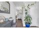Bright entryway with hardwood floors, stylish console table, decor and a charming staircase at 7207 Brigidoon Rose, Douglasville, GA 30134