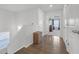 Upstairs hallway with hardwood floors leading to a bedroom at 7207 Brigidoon Rose, Douglasville, GA 30134