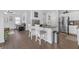 Open concept kitchen with stainless appliances, granite counters, and breakfast bar at 7207 Brigidoon Rose, Douglasville, GA 30134