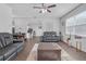 Open-concept living room featuring hardwood floors and ample natural light at 7207 Brigidoon Rose, Douglasville, GA 30134