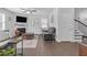 Comfortable living room featuring a fireplace, hardwood floors, and a ceiling fan at 7207 Brigidoon Rose, Douglasville, GA 30134